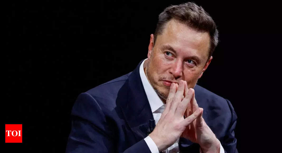 Elon Musk says he's boosting Tesla pay to stop OpenAI from poaching - Times of India